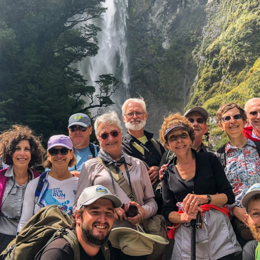 Group at Devils Punchbowl Waterfall, Arthurs Pass National Park, Canterbury New Zealand