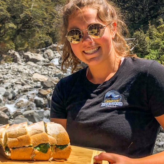 Guide with snack at Arthurs Pass National Park, Canterbury New Zealand