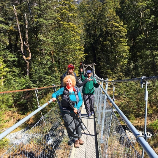 Hikers at Routeburn Track Bridge